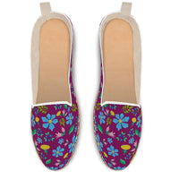 Espadrilles shoes with wild flowers on dark purple