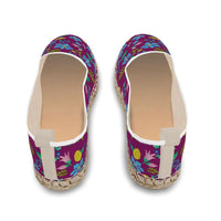 Espadrilles shoes with wild flowers on dark purple